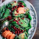 oval ceramic plate with and green and orange food