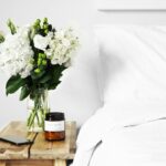 flowers in clear glass vase on table