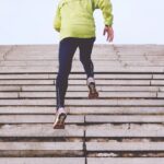 person climbing concrete stairs