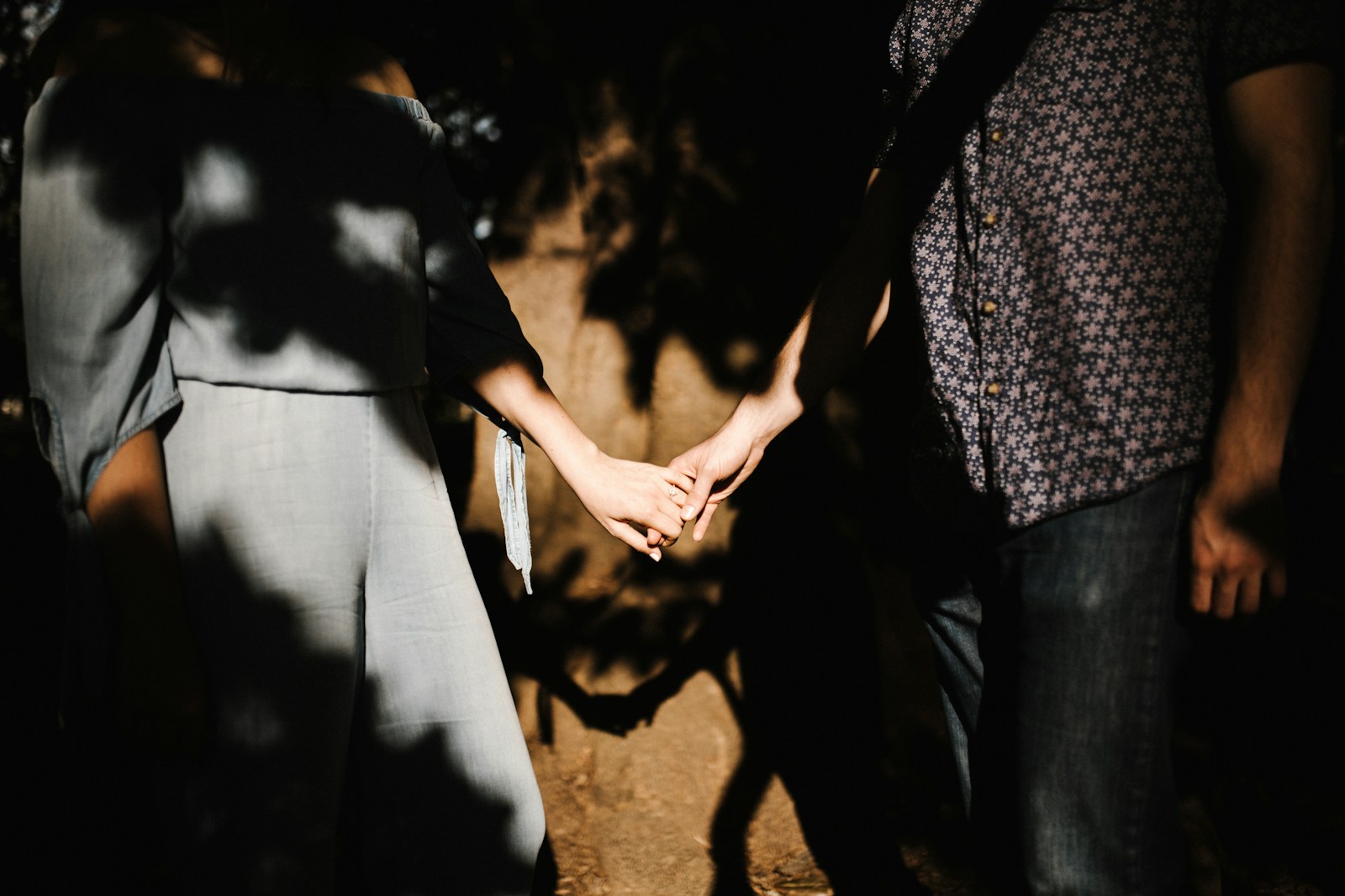 man and woman holding hands